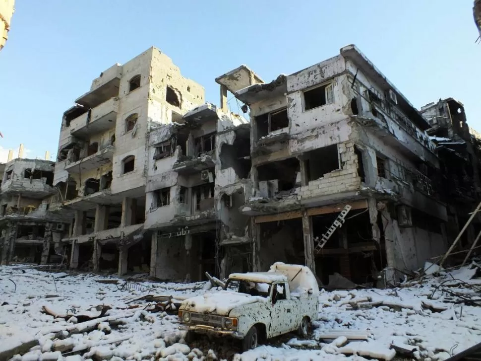 DESOLACIÓN. Los combates en Shayah, un barrio de Homs, han provocado muerte y destrucción. REUTERS