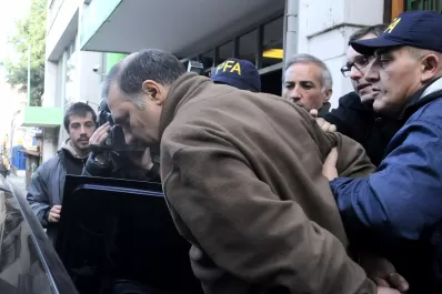 La esposa del portero dijo que lo amenazaron