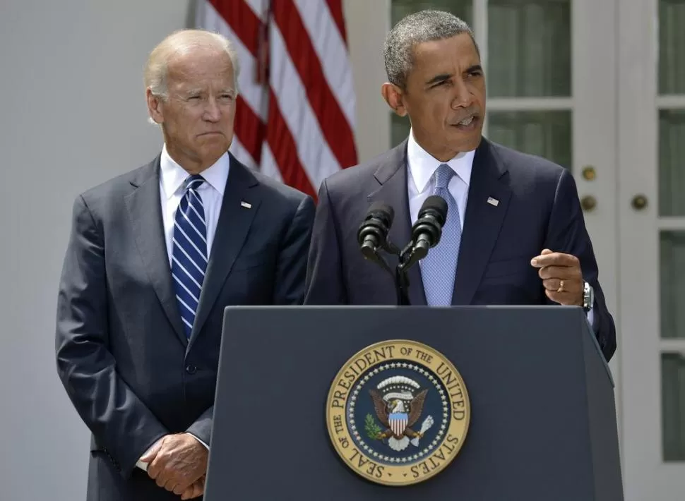 UNIDAD. Obama (respaldado por su vice, Biden), pidió apoyo al Congreso. REUTERS