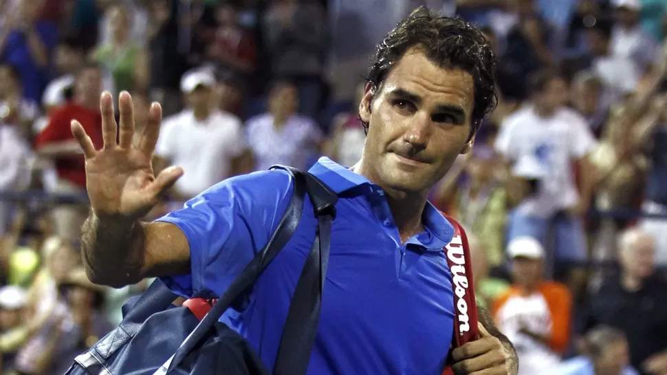 ELIMINADO. El suizo Roger Federer se va conmovido del US Open por la derrota sufrida ante el español Tomy Robredo. REUTERS