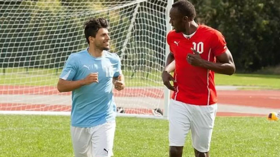 JUNTOS. Sergio Agüero bromea con Usain Bolt en el encuentro de la marca deportiva que les une. FOTO TOMADA DE ABC.ES