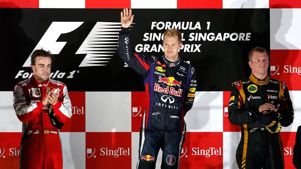 AL PODIO. Alonso, Vettel y Raikkonen terminaron en lo más alto de la carrera corrida en Asia. REUTERS