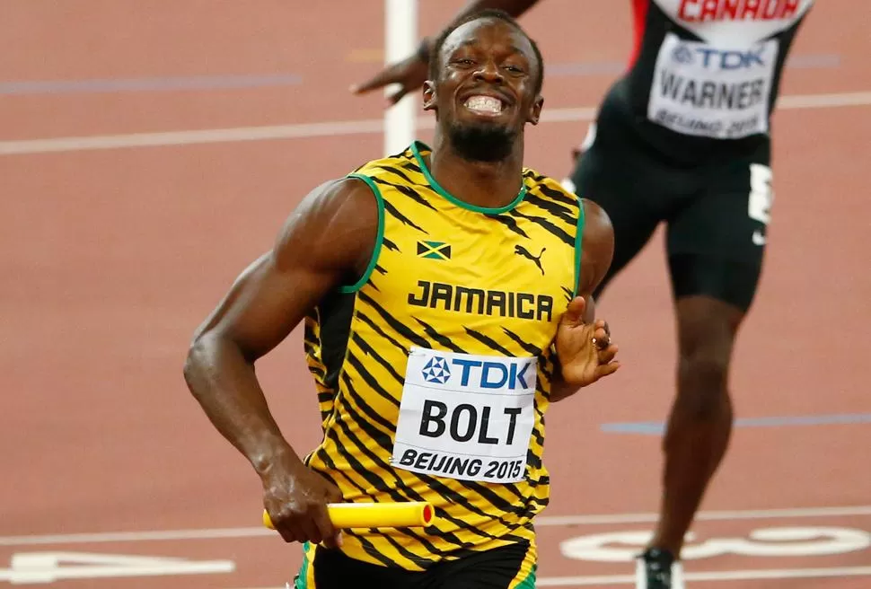 SONRISA DE ORO. Bolt, de 29 años, regresa a Jamaica con todas las medallas doradas. REUTERS