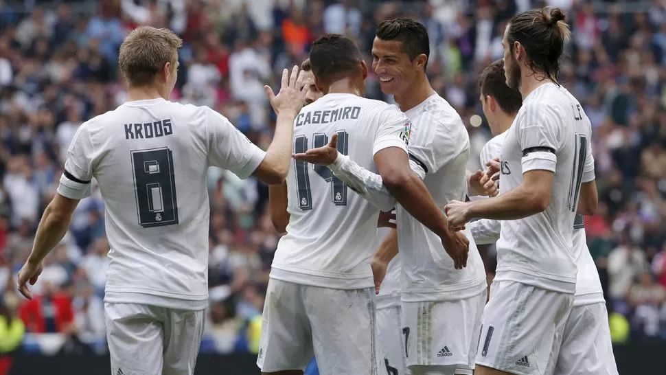 FELICES. Real Madrid volvió a ganar y es líder. (REUTERS)