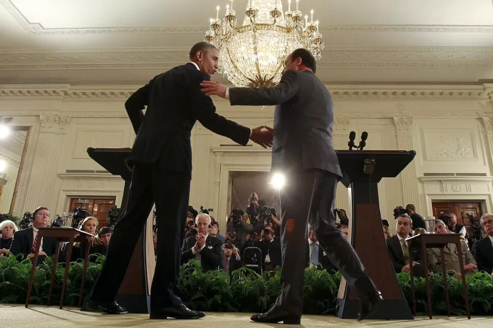 ACUERDO. Obama y Hollande buscan limitar los movimientos de inmigrantes reuters