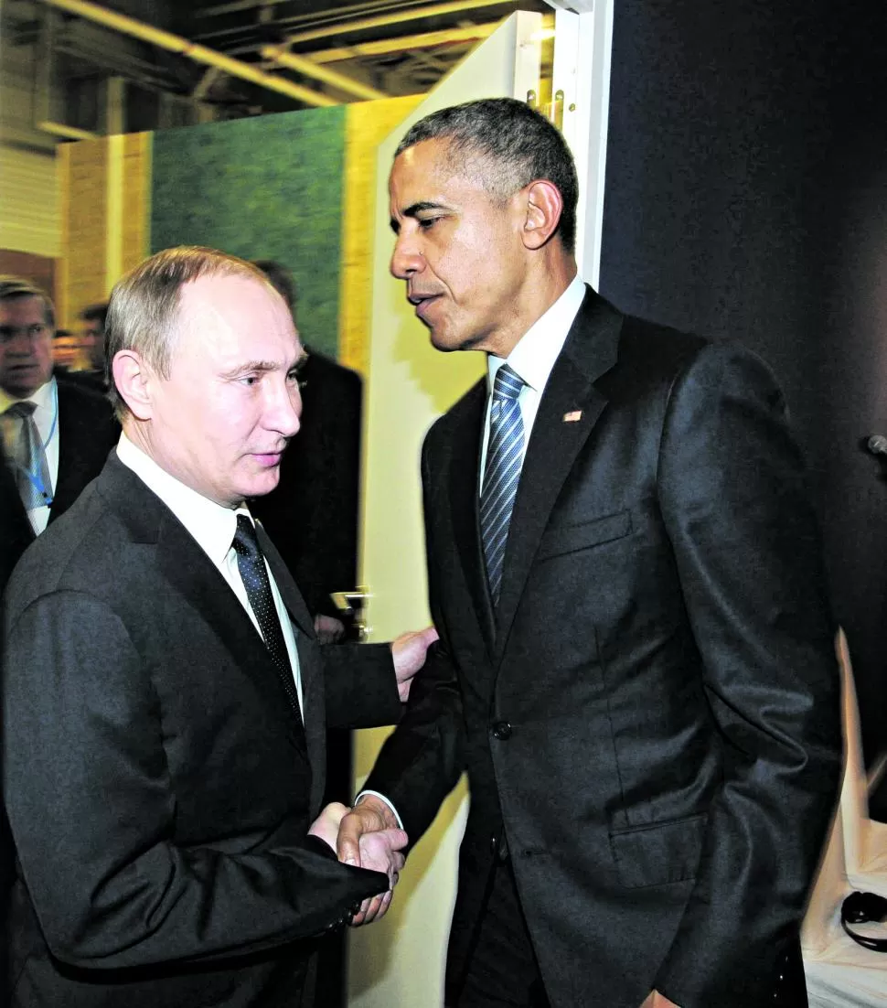 ROSTROS SERIOS. Putin y Obama se saludaron sin sonrisas. reuters