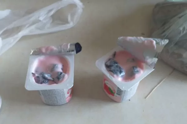 En Lastenia, una mujer intentó pasarle droga oculta en un pote de yogur a un preso