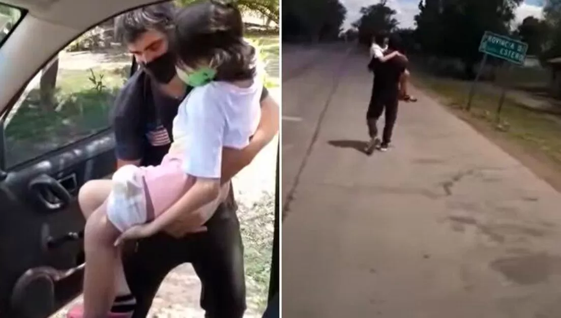 DOLOROSA ESCENA. El padre de Abigail, la niña de 12 años enferma de cáncer, carga en sus brazos a su hija para cruzar de a pie el límite hacia Santiago del Estero, debido a que no les permitieron ingresar con el auto.