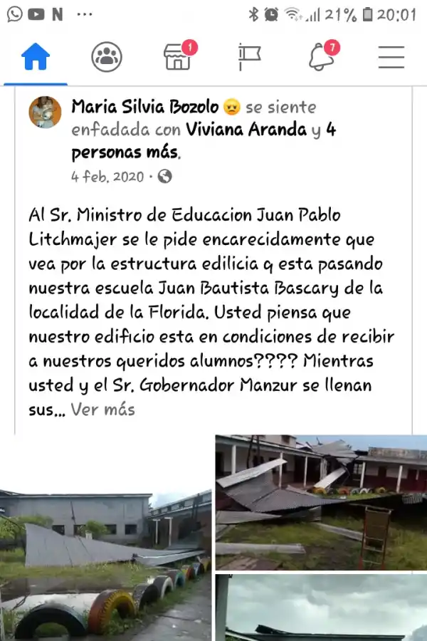 ESCUELA  “JUAN BAUTISTA BASCARY”, de La Florida. Muestra las chapas en el suelo después de una tormenta. Un edificio en malas  condiciones.