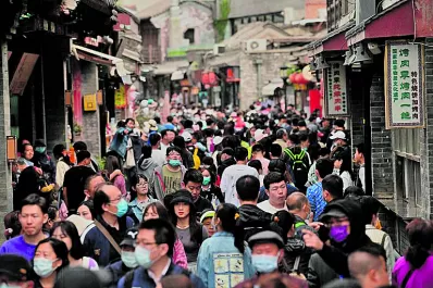 China permitirá tener hasta tres hijos por familia