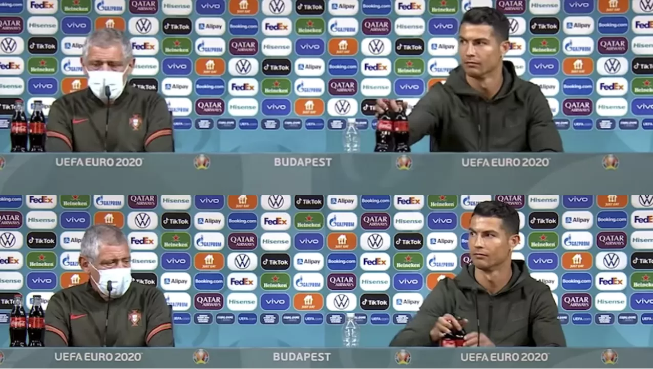 MILITANCIA. Ronaldo (izquierda) retiró de la mesa dos botellas de Coca-Cola durante la conferencia de prensa previa al partido entre Portugal y Hungría, e hizo caer las acciones de la multinacional.