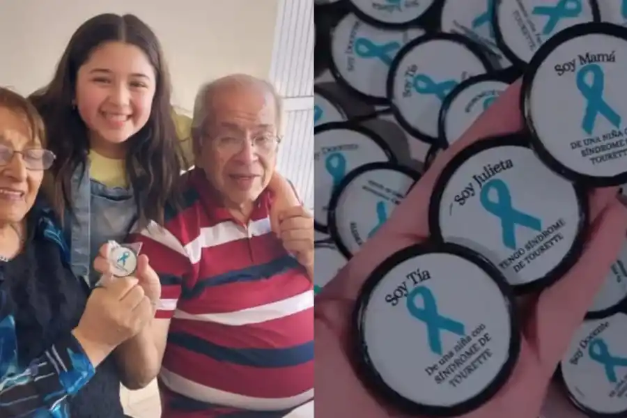 Juli junto a sus abuelos mostrando los pins de su campaña de concientización.