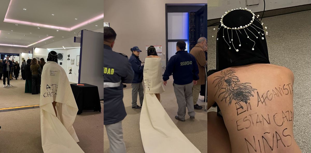 IRRUPCIÓN. Una mujer con velo negro recorrió la feria con una denuncia escrita en la espalda y desconcertó al público, que por momentos la interpretó como parte de una performance.